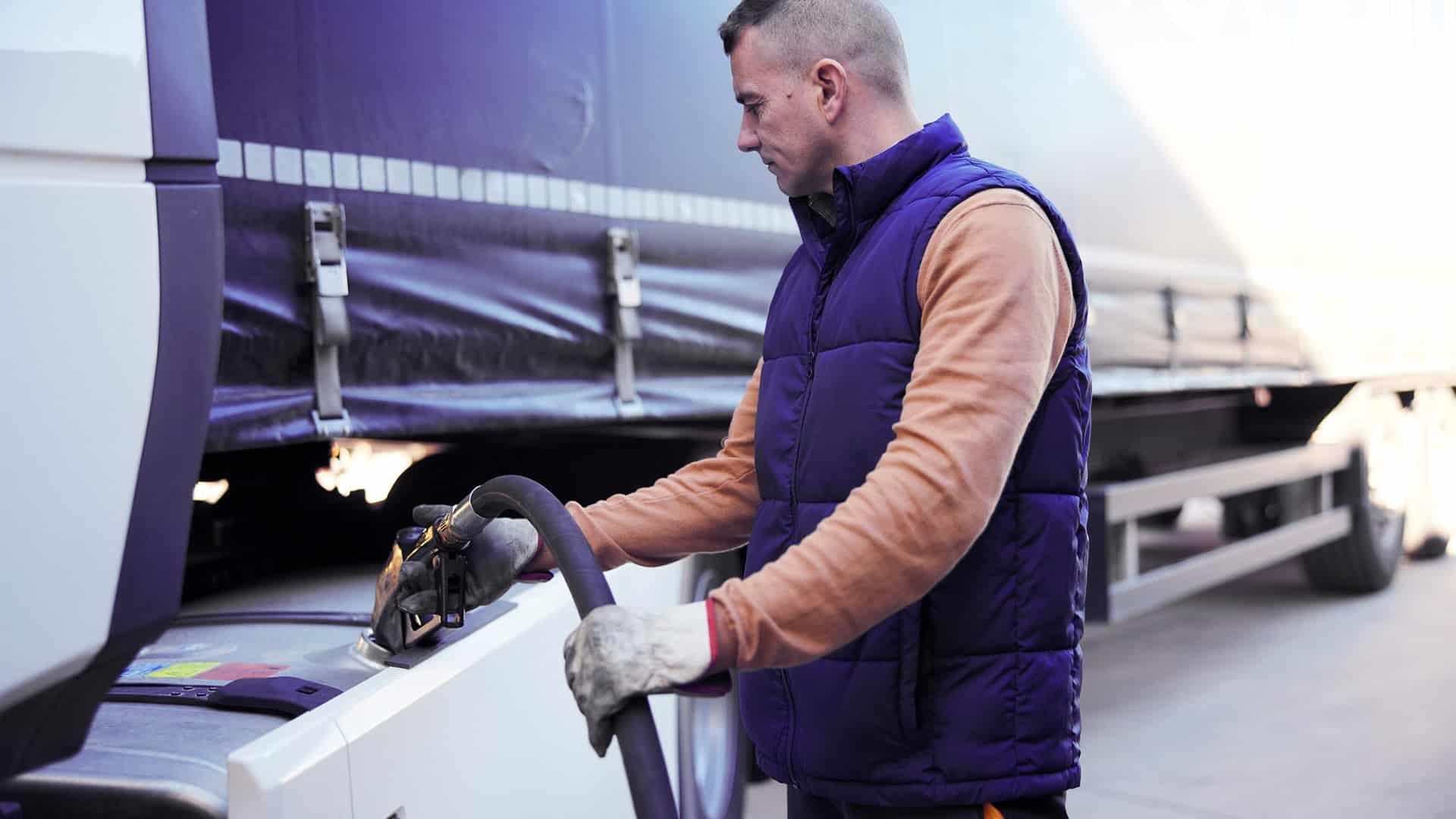 man fueling up a car