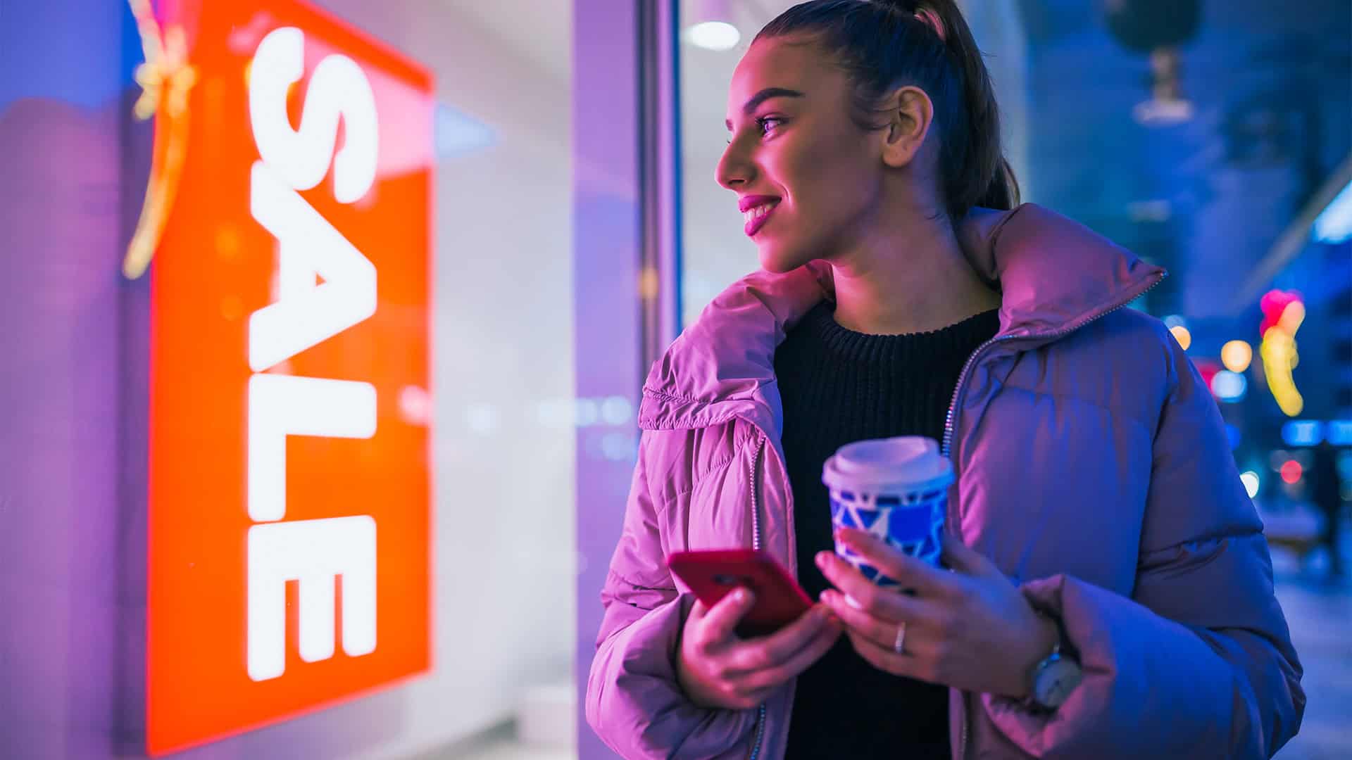 woman looking at sale sign