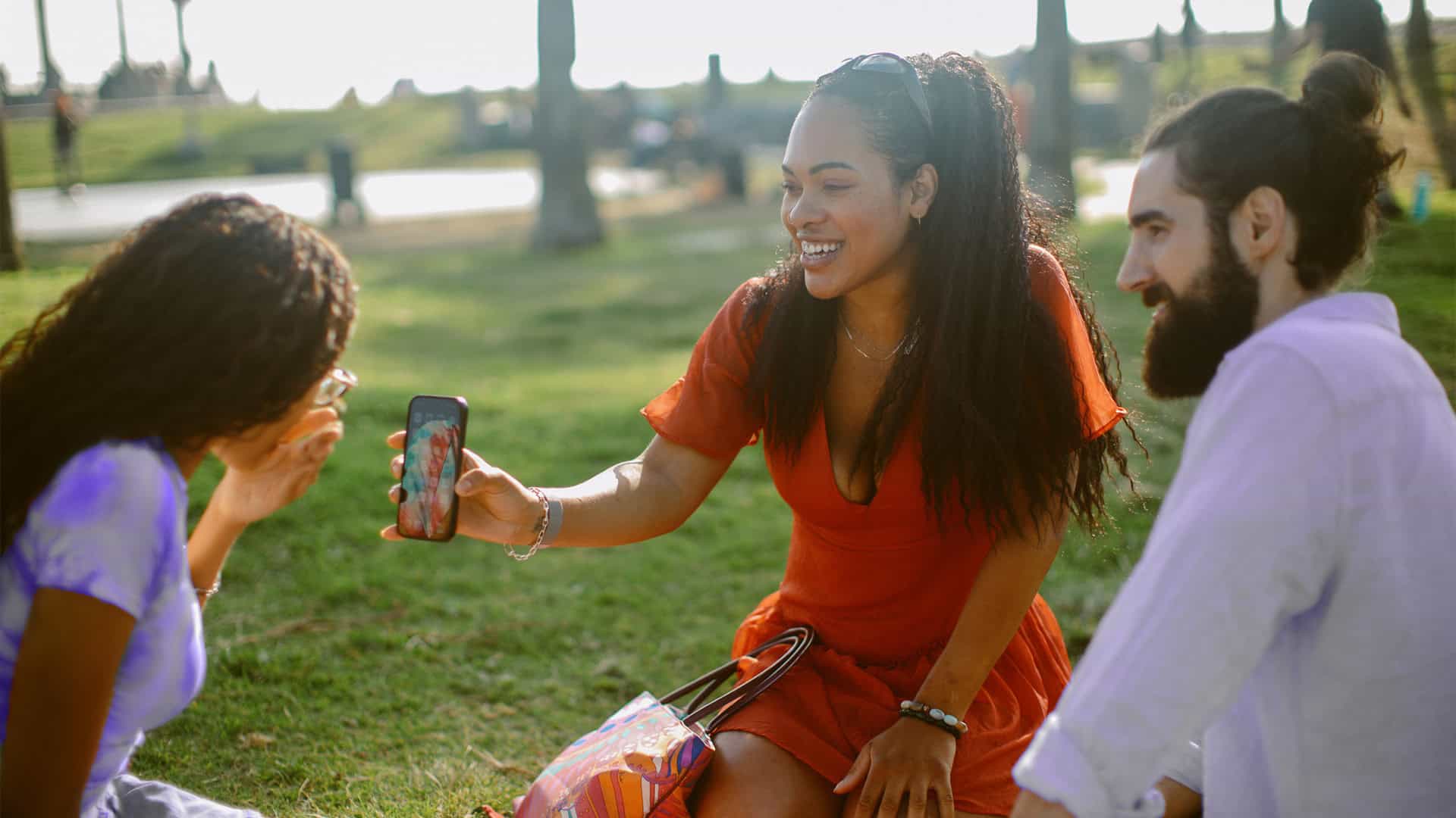 friends sharing social media on phone