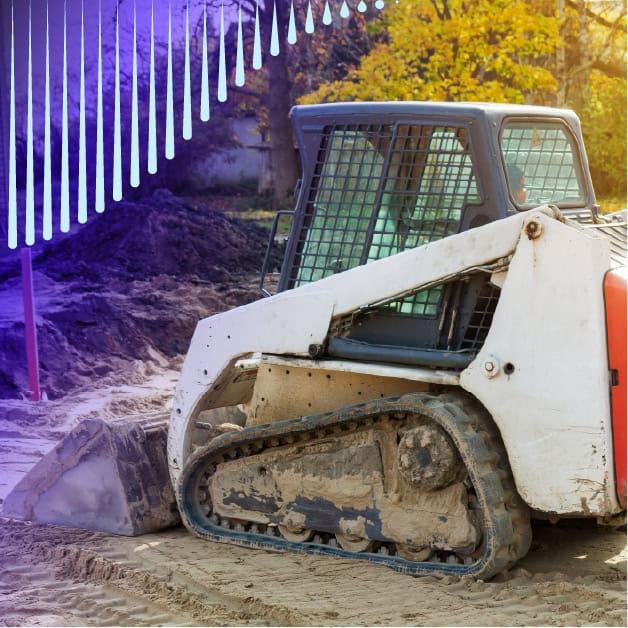 Construction equipment digging in dirt