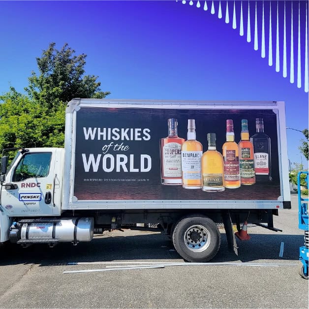 Truck with RNDC truck wrap advertising whiskey