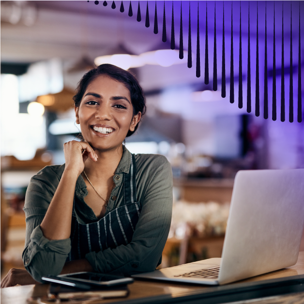 Woman smiling at her laptop