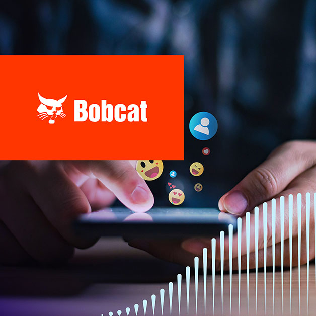 Bobcat logo with person using smartphone with floating emojis