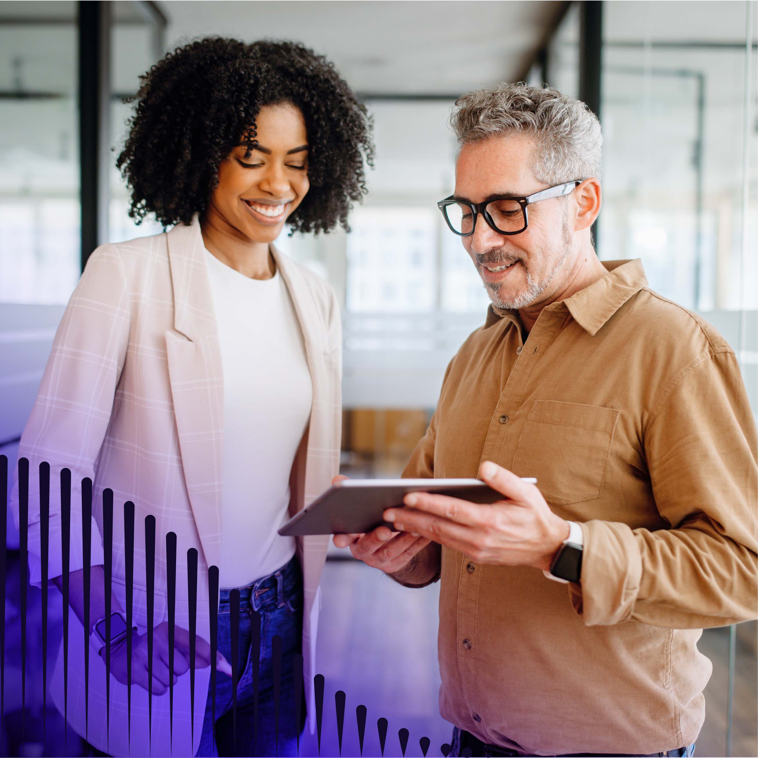 Man and woman looking at tablet