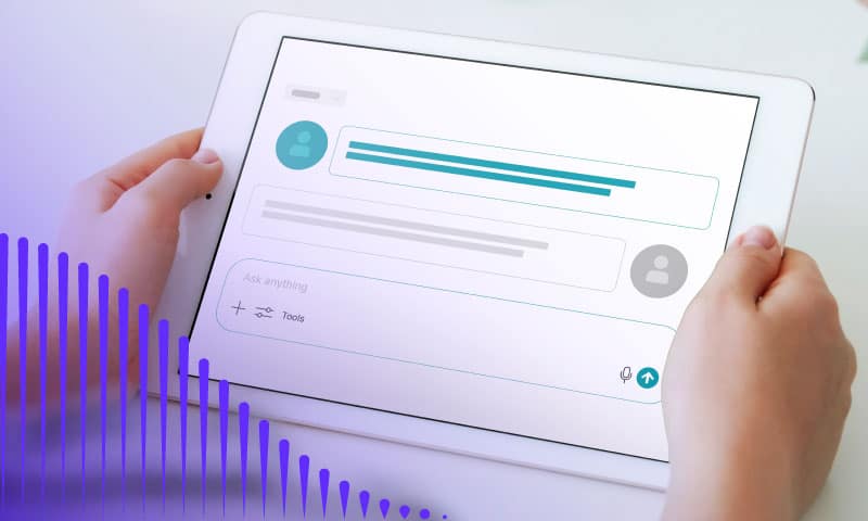 Hands holding tablet with AI chat window