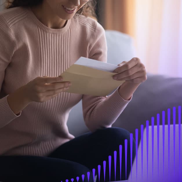 Woman reading a piece of mail